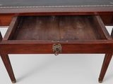 an image of a small wooden desk with a drawer underneath it