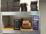 a lot of boxes on the shelves in the room