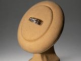 ring holder in the shape of a sphere with a ring on it