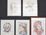 several framed portraits of people are displayed on a wall