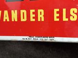 a red sign that says vander elst on it