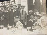 a group of men and women posing for a picture