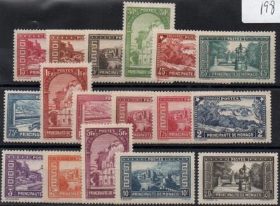 several different stamps of different colors and sizes are on a black surface
