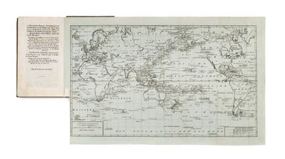an old map of the world with a book open