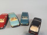 several toy cars are lined up in a row on a table