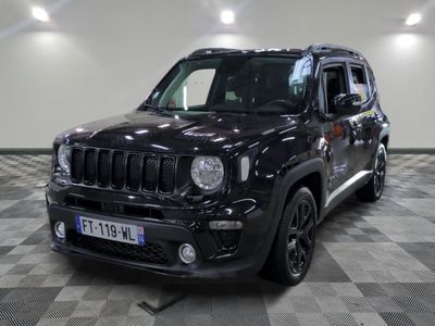 the black jeep is parked in the garage on a checkered floor
