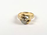 yellow gold ring with a black pearl in the middle of it
