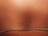 the inside of a brown bag with a zipper on it