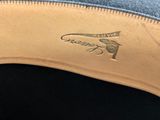 a close up of a pair of shoes on a black surface