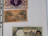 two different bills in a folder on a table