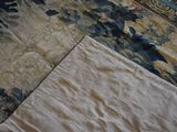 a close up of a bed with a quilt on it