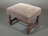 an image of a small foot stool with a cushion on it