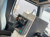 an image of a vehicle with a machine in the back seat