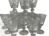 a lot of empty wine glasses sitting on a table