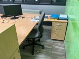 a desk with a computer and a monitor on it