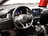the interior of a car with a steering wheel, dashboard, and display screen