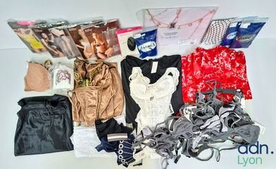 a lot of clothes and accessories laid out on a table