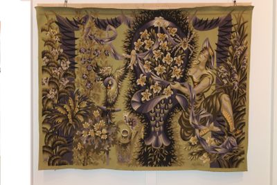 a tapestry hanging on the wall in a room