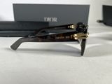 christian dior sunglasses with box and case on table