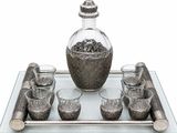 a glass tray with a bottle and glasses on it