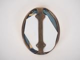 a picture of a metal object with a cross on it