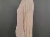 a white blouse with ruffles on a mannequin mannequin mannequin mannequin mannequin mannequin mannequin manne
