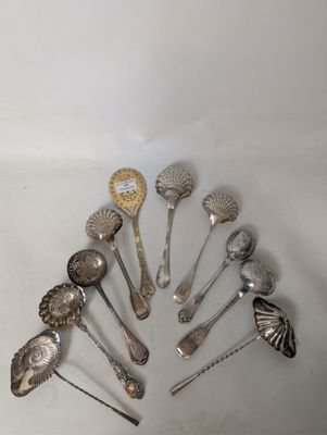 a lot of silver spoons and spoon spoons on the table