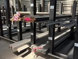 a lot of metal shelves in a warehouse with a bunch of flowers