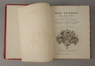 an open book with a picture of a coat of arms and a crown on it