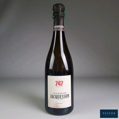 a bottle of wine that is sitting on a table