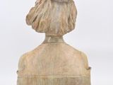 an image of a statue of a woman with a hat on her head