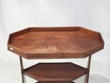 an image of a wooden table with three shelves