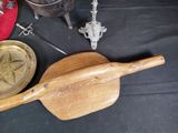 a wooden paddle with a star on it next to other items on a table
