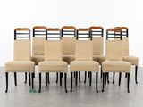 a set of six dining chairs with black legs and a beige upholstered seat