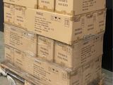 a stack of boxes sitting on a pallet in a warehouse