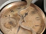 an old pocket watch that is sitting in a box
