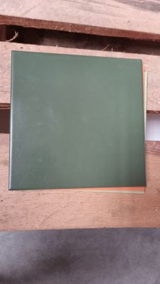 a blackboard sitting on a wooden table in a room