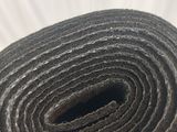 the rolled up roll of fabric is sitting on a table