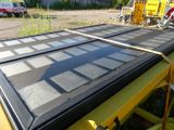 a large window that is sitting on top of a yellow table