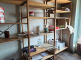 a room with a wooden floor and a wooden book shelf
