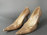 an image of a pair of women ' s shoes on a gray surface