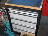 a workbench with tools on it in a garage