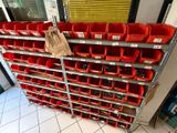 many red bins on the shelves in the store