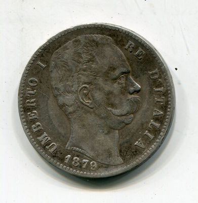 une vieille pièce de monnaie sur laquelle est représenté le visage d'un homme