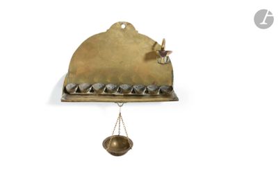a clock that is hanging on the wall with a bird on it