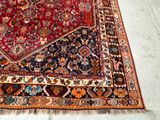 an image of a large oriental rug on a white floor