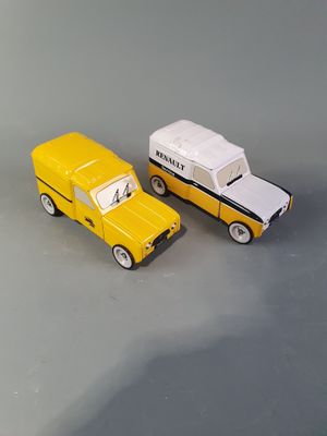 two toy cars sitting next to each other on a table