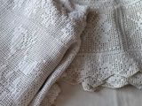 two pieces of cloth that are laying on a bed