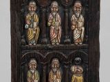 an image of a wooden chair that has a shelf with figurines on it