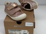 baby girl ' s shoes in a box on a white surface